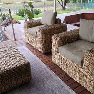 Wicker patio lounge suite with sofa and armchairs