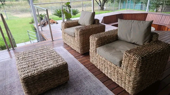 Wicker patio lounge suite with sofa and armchairs